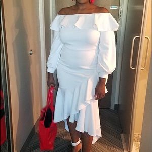 White off the shoulder high low ruffle dress.